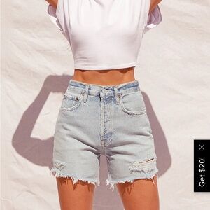 AGOLDE Riley light wash distressed denim shorts